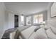 Comfortable bedroom with hardwood floors, closet, and a view of the living area at 8260 E Arabian Trl # 257, Scottsdale, AZ 85258