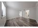 Bedroom with wood floors and views to bathroom and hall at 8260 E Arabian Trl # 257, Scottsdale, AZ 85258