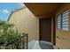 Welcoming front door with textured walls and a modern security system at 8260 E Arabian Trl # 257, Scottsdale, AZ 85258