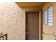 Inviting front door with decorative details and secure entry system at 8260 E Arabian Trl # 257, Scottsdale, AZ 85258