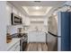 Well-lit kitchen with quartz counters, stainless steel appliances, and bright white cabinetry at 8260 E Arabian Trl # 257, Scottsdale, AZ 85258