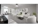 Bright living room featuring modern decor, light gray walls, stylish furniture, and durable wood-look flooring at 8260 E Arabian Trl # 257, Scottsdale, AZ 85258
