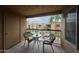 View of a patio with a table and chairs overlooking well-maintained landscaping and neighboring buildings at 8260 E Arabian Trl # 257, Scottsdale, AZ 85258