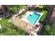 An aerial view of a community pool, showcasing a covered area with lounge chairs for relaxing by the water at 8260 E Arabian Trl # 257, Scottsdale, AZ 85258