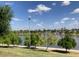 Scenic view of the lake with lush green trees and a clear blue sky at 849 W Duke Dr, Tempe, AZ 85283