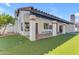Backyard featuring covered patio, putting green, and mature trees at 9736 E Turquoise Ave, Scottsdale, AZ 85258