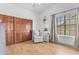 Bright ' bedroom with hardwood floors, closet, and a charming reading nook at 9736 E Turquoise Ave, Scottsdale, AZ 85258