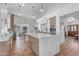 Beautiful kitchen with marble island, stainless steel appliances, custom cabinets, and terracotta flooring at 9736 E Turquoise Ave, Scottsdale, AZ 85258