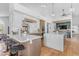 Bright, open kitchen with marble countertops, white cabinets, modern appliances, and terracotta tile flooring at 9736 E Turquoise Ave, Scottsdale, AZ 85258