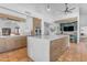 Spacious kitchen featuring a large marble island, custom cabinets, and modern appliances at 9736 E Turquoise Ave, Scottsdale, AZ 85258