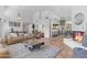 Open floor plan with a bright living room, dining area, and kitchen with a large island at 9736 E Turquoise Ave, Scottsdale, AZ 85258