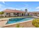 Backyard pool and spa with fenced in yard, patio, and red tile roof at 9736 E Turquoise Ave, Scottsdale, AZ 85258
