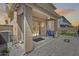 Back patio offers a seamless transition to outdoor living with covered space and well-maintained pavers at 9916 E Texas Ave, Mesa, AZ 85212