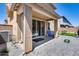 Back patio offers a seamless transition to outdoor living with covered space and well-maintained pavers at 9916 E Texas Ave, Mesa, AZ 85212