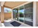 Covered back patio featuring large glass sliding doors seamlessly blending indoor and outdoor living at 9916 E Texas Ave, Mesa, AZ 85212
