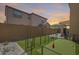 This backyard features a built in putting green for at home practice at 9916 E Texas Ave, Mesa, AZ 85212