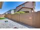 Private backyard with brick fence, paver patio, and low-maintenance desert landscaping at 9916 E Texas Ave, Mesa, AZ 85212
