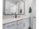 Bright bathroom featuring a modern vanity with a large framed mirror and ample counter space at 9916 E Texas Ave, Mesa, AZ 85212
