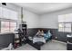Bright bedroom featuring a comfortable bed, playful decor, and ample natural light at 9916 E Texas Ave, Mesa, AZ 85212