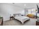 Inviting bedroom with a comfortable bed, a sitting area, and neutral decor for a relaxing atmosphere at 9916 E Texas Ave, Mesa, AZ 85212