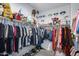 Spacious walk-in closet featuring ample storage with clothes, bags and shoes on display at 9916 E Texas Ave, Mesa, AZ 85212