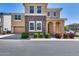 Beautiful two-story home featuring brick accents, manicured bushes, and a two-car garage at 9916 E Texas Ave, Mesa, AZ 85212