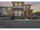 Beautiful two-story home featuring brick accents, manicured bushes, and a two-car garage at 9916 E Texas Ave, Mesa, AZ 85212