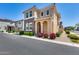 Charming two-story home showcasing well-maintained landscaping and classic architectural design at 9916 E Texas Ave, Mesa, AZ 85212