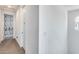Bright hallway with a door and carpeted floors at 9916 E Texas Ave, Mesa, AZ 85212