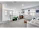 Comfortable loft area with white railing, a cozy white couch, and plenty of natural light at 9916 E Texas Ave, Mesa, AZ 85212