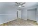 Bright bedroom with ceiling fan, light colored walls, and closet at 10016 N 39Th Dr, Phoenix, AZ 85051