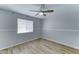 Clean bedroom with light colored walls, tile flooring, and a bright window at 10016 N 39Th Dr, Phoenix, AZ 85051