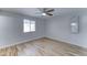 Bedroom with wood-look tile, a ceiling fan, and natural light from a window at 10016 N 39Th Dr, Phoenix, AZ 85051