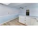 Dining area with stylish flooring, counter seating and convenient laundry room access at 10016 N 39Th Dr, Phoenix, AZ 85051