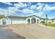 This inviting single-story home features a well-kept front yard, driveway and a basketball hoop at 10016 N 39Th Dr, Phoenix, AZ 85051