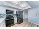 Modern kitchen with stainless steel appliances, tile backsplash, and bright lighting at 10016 N 39Th Dr, Phoenix, AZ 85051