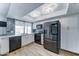Modern kitchen with stainless steel appliances, white cabinetry, stylish backsplash, and plenty of natural light at 10016 N 39Th Dr, Phoenix, AZ 85051