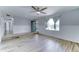 Bright living room features wood-look floors, wainscotting, ceiling fan and view to the entry at 10016 N 39Th Dr, Phoenix, AZ 85051