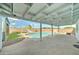 Backyard featuring a refreshing pool, slide, lush grass, and a covered patio at 10016 N 39Th Dr, Phoenix, AZ 85051