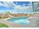 Backyard pool features a slide and concrete surround, offering a perfect space to relax and enjoy outdoor activities at 10016 N 39Th Dr, Phoenix, AZ 85051