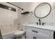 This bright bathroom features white subway tile, a modern vanity, and a round mirror at 10831 E Azalea Ave, Mesa, AZ 85208