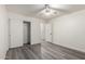 This clean bedroom has wood-look floors, double closets, and white trim at 10831 E Azalea Ave, Mesa, AZ 85208