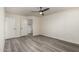 The bedroom features modern flooring, a ceiling fan, and closet access at 10831 E Azalea Ave, Mesa, AZ 85208