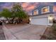 Charming two-story home featuring a large two car garage, beautiful blue siding, and a lovely tiled roof at 10831 E Azalea Ave, Mesa, AZ 85208