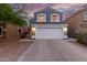 Charming two-story home featuring a large two car garage, beautiful blue siding, and a lovely tiled roof at 10831 E Azalea Ave, Mesa, AZ 85208