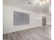 Spacious living room with light gray flooring, a ceiling fan, and large sliding glass doors at 10831 E Azalea Ave, Mesa, AZ 85208