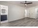 The main bedroom has wood-look flooring and an ensuite bathroom and walk-in closet at 10831 E Azalea Ave, Mesa, AZ 85208