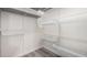 A walk-in closet with white wire basket shelving and wood-look flooring at 10831 E Azalea Ave, Mesa, AZ 85208