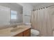 Clean bathroom featuring a shower, toilet, sink and mirror with vanity at 12605 W Dreyfus Dr, El Mirage, AZ 85335