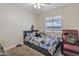 Cozy bedroom featuring a ceiling fan and plenty of natural light at 12605 W Dreyfus Dr, El Mirage, AZ 85335